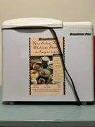 Grouping of small kitchen appliances, electric griddle, fondue set, breadmaker and more