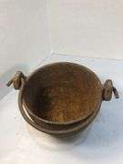Antique smelting pot. 5” diameter. Plus round block of metal.