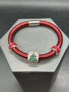 Elegant Brighton bangle with rhinestone Christmas tree charm and 2 red stone separators…..has magnetic closure and bag