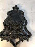 J.Z.H. 1948 cast iron Sunburst trivet. Black. Footed. 9 x 5”