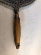 Antique stovetop heat diffuser, also known as a simmer plate or flame fanner with wooden handle, 14 L. 8 1/4” diameter.