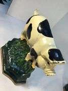 Vintage pair of cast iron black and white spotted pig book ends/door stops. 5 1/2” W x 5” H x 2”D.