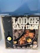 Lodge #12 12” 6 quart outdoor Dutch oven with flanged lid and integral legs. Stored in original box. Possibly new.