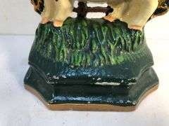 Vintage pair of cast iron black and white spotted pig book ends/door stops. 5 1/2” W x 5” H x 2”D.