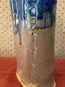 Beautifully designed and handcrafted Owl Eyes Pottery glaze drip vase (has appearance of dripping candle wax)…..9-1/2” tall….Owl Eyes Pottery are pieces designed by the seller and are food safe….has (1) firing defect