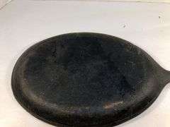 Oval fajita skillet/sizzler 15” L.  9.5 x 7” cooking surface. 0 on underside of handle is the only marking.
