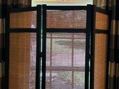 Wooden tri-fold screen with faux bamboo fillers on each panel……each panel measures 16” and is 71” tall