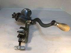 Antique Ward’s silver metal meat grinder. Wooden handle hand crank. Clamp for attaching to  surface for grinding meat. In excellent condition