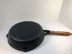 10” diameter 2 spout skillet with wooden handle. Made in Taiwan.