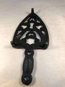 Vintage SAD iron rest/ trivet cast iron, scroll design. Footed.  8 x 3.5”