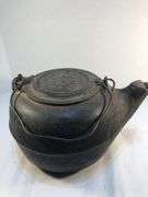 Antique gate marked #8 cast iron tea kettle. Starburst pattern. 11 1/2” x 9 1/2 “ 6.5” H.