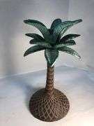 Unusual vintage pair of cast iron palm tree candle holders. Green and brown. 7 3/4” H. Base 4”W.