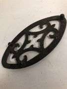 Antique child SAD iron footed trivet. Black. 3.5 x 2”
