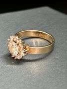 14K yellow gold diamond ring with solid center diamond surrounded by 14 smaller diamonds…..total carat weight is approximately 2.75 carats…..NO APPRAISAL OR PAPERWORK IS INCLUDED…..size 8-3/4