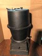 Antique cast iron #19 Buckeye Incubator Co. cast iron coal stove. 22” H x 11.5” W.