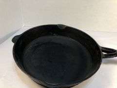 10” diameter 2 spout skillet with wooden handle. Made in Taiwan.