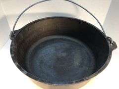 Lodge #12 12” 6 quart outdoor Dutch oven with flanged lid and integral legs. Stored in original box. Possibly new.