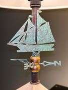 Pair of matching wood base lamps with metal weathervane decor…..16” tall