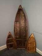 Collection of boat shaped shelving in various sizes