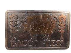 1978 Taylor & Co. bacon press.  Wooden handle. Decorative bottom; pig and floral 7.5 x 4.5”