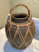 Pair of decorative water vessels encased in rattan…..11” tall