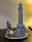 Nice selection of lighthouses made from various materials…..far left is musical (needs batteries, far right is a bank…..heights range from approx. 12-1/2 to 13-1/2” tall