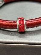 Elegant Brighton bangle with rhinestone Christmas tree charm and 2 red stone separators…..has magnetic closure and bag