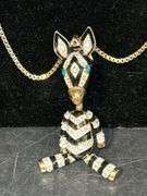 Betsey Johnson box chain with animated zebra pendant and a pair of black/white stone earrings