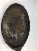 Oval fajita skillet/sizzler 15” L.  9.5 x 7” cooking surface. 0 on underside of handle is the only marking.