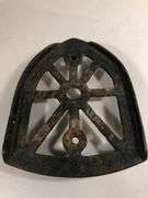 Antique cast iron trivet, specifically designed as a rest for a "sad iron" or "flat iron". 6 x 4.5”