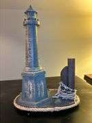 Nice selection of lighthouses made from various materials…..far left is musical (needs batteries, far right is a bank…..heights range from approx. 12-1/2 to 13-1/2” tall