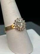 14K yellow gold diamond ring with solid center diamond surrounded by 14 smaller diamonds…..total carat weight is approximately 2.75 carats…..NO APPRAISAL OR PAPERWORK IS INCLUDED…..size 8-3/4