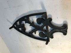 Vintage black, footed cast iron trivet. 8 x 3.75”