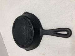 6 1/2” #2  3 notch skillet with heat ring and 2 spouts. Rounded interior surface. Made in Korea.