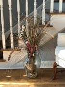 Clear glass urn with artificials…..approx. 46” tall including artificials