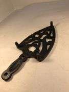 Vintage SAD iron rest/ trivet cast iron, scroll design. Footed.  8 x 3.5”