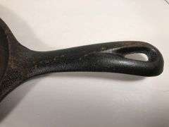 Lodge oval sizzle server #2. Surface area 9.5 x 7”. Not seasoned. No spin or wobble.