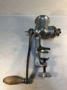 Antique Ward’s silver metal meat grinder. Wooden handle hand crank. Clamp for attaching to  surface for grinding meat. In excellent condition