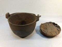 Antique smelting pot. 5” diameter. Plus round block of metal.