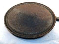 Wagner Ware cast iron griddle, specifically a No. 9 Sidney Arc Logo  Griddle. H G. 10.5” diameter. HS marked. No spin, no wobble.