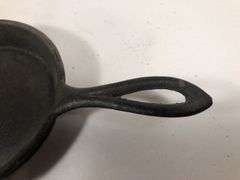 1800s gate marked Lodge #7 pointy handle 4” skillet with single spout and heat ring.