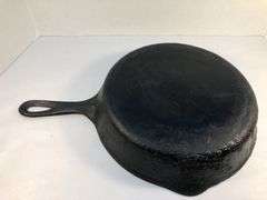 Unmarked #8  10” diameter 2 spout skillet. No spin, no wobble.