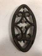 Antique child SAD iron footed trivet. Black. 3.5 x 2”
