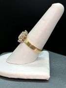 14K yellow gold diamond ring with solid center diamond surrounded by 14 smaller diamonds…..total carat weight is approximately 2.75 carats…..NO APPRAISAL OR PAPERWORK IS INCLUDED…..size 8-3/4