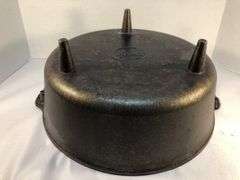 Lodge #12 12” 6 quart outdoor Dutch oven with flanged lid and integral legs. Stored in original box. Possibly new.