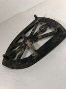Antique cast iron trivet, specifically designed as a rest for a "sad iron" or "flat iron". 6 x 4.5”