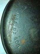 Lodge 9” diameter cornbread skillet.  USA D2 8CB