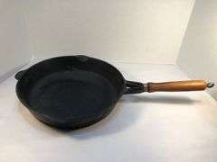 10” diameter 2 spout skillet with wooden handle. Made in Taiwan.
