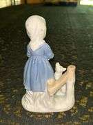 Vintage Porcelain Figurine of Girl in Blue Dress Holding White Bunny Rabbit with Dog by her side….5-3/4” tall….original label which reads by Lego