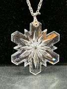 Dress up or dress down this glass snowflake necklace